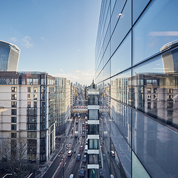 City streetscape with blue skies and glass buildings